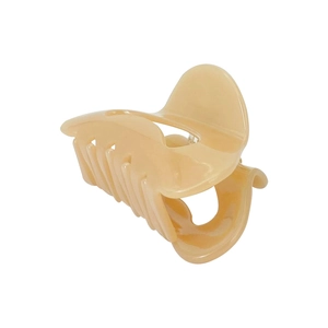 Elegant beige crescent acetate hair claw clip for bun styling on a white background