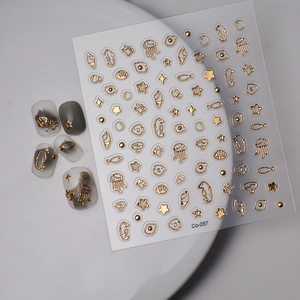 Detailed view of 5D gold embossed sea creature nail stickers featuring jellyfish and seahorses