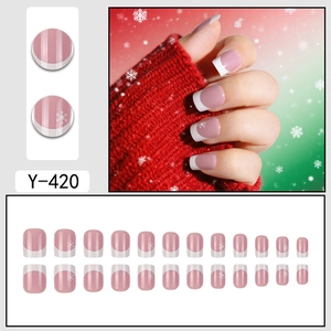 Short square French press-on nails with white snowflakes and pink base for Christmas