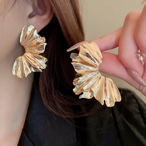 Exaggerated golden pleated fan-shaped metal earrings with textured geometric design