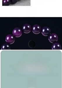 Macro view of polished purple Bodhi root beads showing natural texture and smooth finish