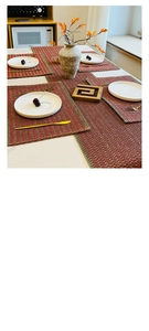 Detail of red and green woven paper rope placemats with festive Christmas texture