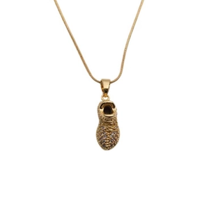 Golden high-top sneaker pendant necklace with sparkling cubic zirconia on fine link chain