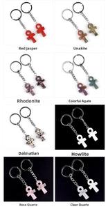 Detailed selection of Ankh keychains in red jasper, rose quartz, and natural stones