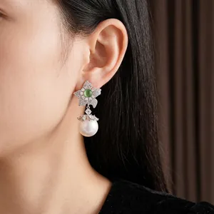 Vintage luxury earrings with zircon flower, green gemstone, and large white pearl drops