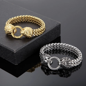 Detail of hip hop lion head clasp on double braided chains in gold and silver finish