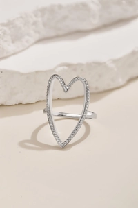 Close-up of S925 sterling silver hollow heart ring with sparkling pavé zircon stones