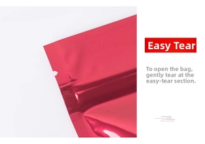 Macro shot of U-shaped easy-tear notch on red metallic aluminum foil packaging bag