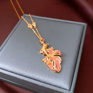 24K gold plated koi fish necklace with pink enamel and zircons on a velvet box