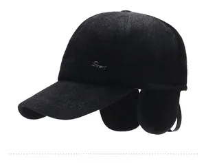 Detail of warm faux mink winter baseball cap with ear flaps and Sport metal badge