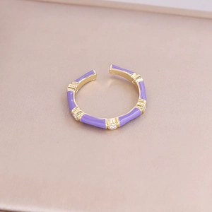 Detailed view of bamboo joint ring with purple enamel and sparkling crystal accents