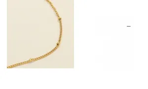 Detailed macro view of the gold-plated titanium steel chain with circular twist decorative links