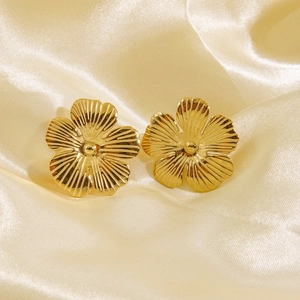 Elegant 14K gold plated stainless steel flower stud earrings on silk fabric