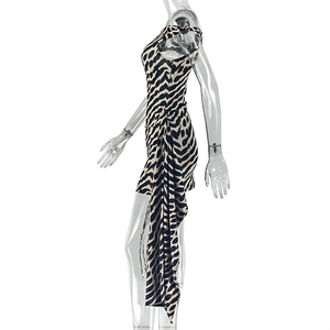 Detail of leopard print mini dress featuring asymmetric side drape and sleeveless design