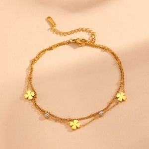 Double-layered gold stainless steel anklet featuring clover charms and zircon stones