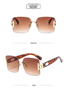Detail view of square rimless sunglasses with leopard temples and brown gradient lenses