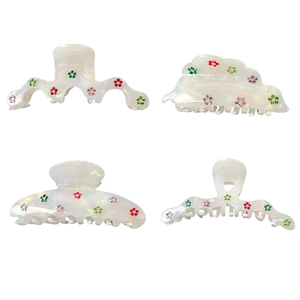 Elegant white iridescent acetate hair claw clip with colorful rhinestone floral patterns