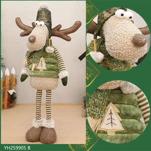 Detail of green fabric Christmas reindeer figurine with camo hat and stable standing legs