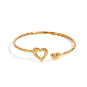 Minimalist gold stainless steel open bangle featuring heart shapes on white background