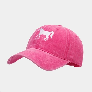 Close-up of rose pink baseball cap with white horse embroidery and curved brim