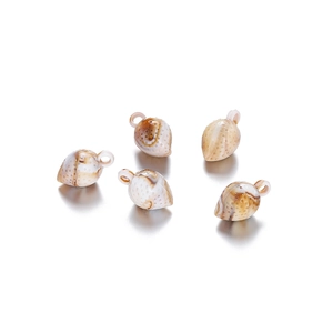 Detailed macro view of five strawberry-shaped acrylic shell pendants with marble texture