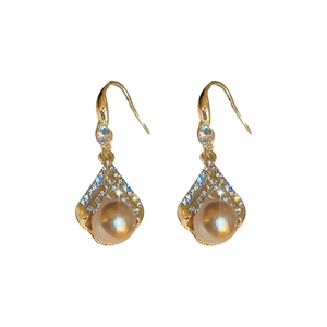 Elegant gold drop earrings featuring a pearl and sparkling zircons in a vintage style