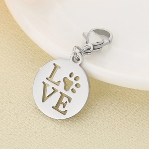 Detail of silver stainless steel MOM charm with heart cut-outs and lobster clasp