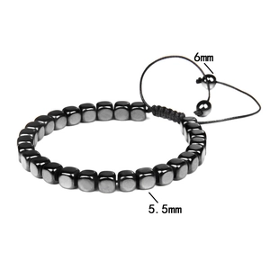 Detail view of woven hematite bracelet with 5.5mm square beads and 6mm round bead accents