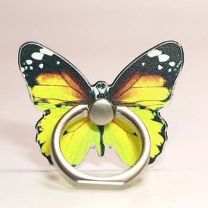 Detailed macro shot of an orange butterfly ring phone holder with polished silver metal grip