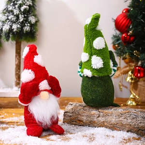 Pair of red and green plush Christmas gnomes with knit hats and white spot patterns