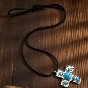 Vintage cross necklace with turquoise stones and silver hammered texture on leather cord