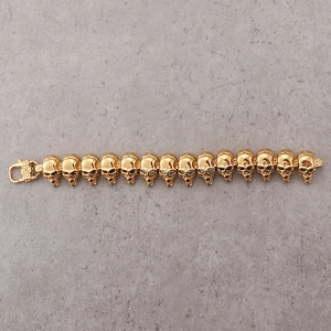 Détails du bracelet punk à maillons têtes de mort en acier inoxydable doré avec fermoir