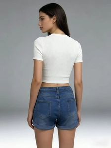 Slim fit denim shorts and knit crop top back view showing seam detail and fit