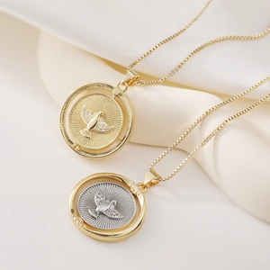 Rotatable eagle pendant necklace with zircons in gold and two-tone finishes