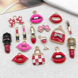 Detailed flat lay of colorful enamel charms including lipsticks, bows and heels