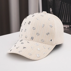 Beige corduroy baseball cap with silver metal letter studs for a street style look