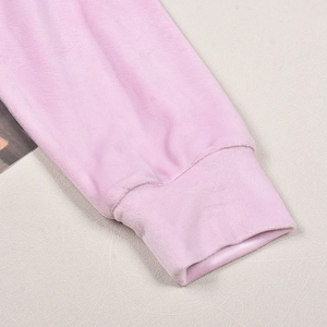 Detail of light pink fleece hoodie sleeve cuff showing soft velvet texture and ribbing