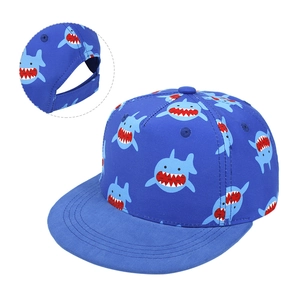 Detail of adjustable velcro strap and shark print on blue kids flat brim snapback cap