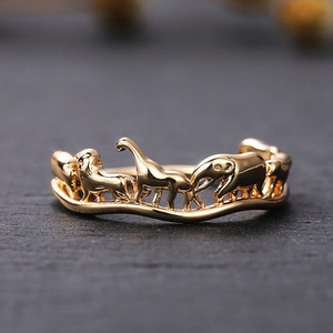 Japanese style animal circus relief ring in gold featuring elephant and giraffe motifs