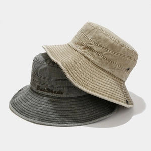 Detail view of washed cotton bucket hats with SunShade embroidery and metal eyelets