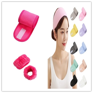 Detail of coral fleece headband and wristbands set showing Velcro and multiple colors