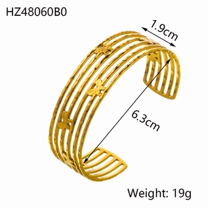 Gold-tone layered butterfly cuff bracelet featuring an open C-shape minimalist design