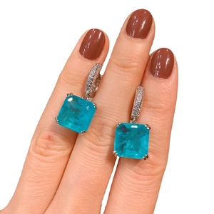 Emerald cut Paraiba blue gemstone drop earrings with silver pave hook detail