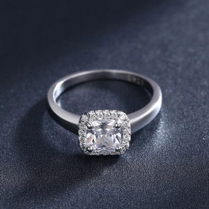 Elegant S925 sterling silver ring with square zircon halo design on dark background