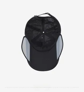 Internal view of black outdoor sun hat showing breathable white mesh and ear protection flaps
