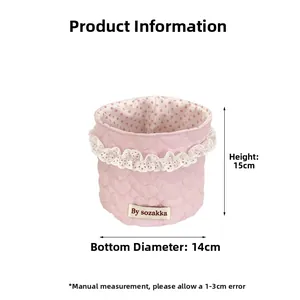 Close-up of pink heart-quilted storage basket with lace trim and dot pattern lining