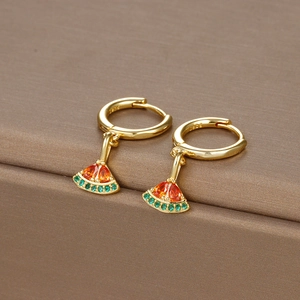 Close-up of gold S925 earrings featuring vibrant orange and green cubic zirconia stones