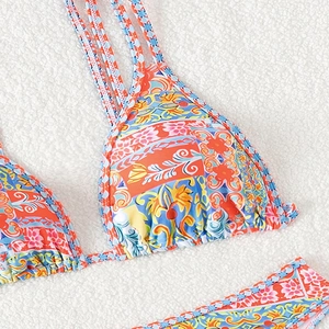 Women's vibrant bohemian floral print bikini set with triangle cups on white background