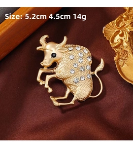 Close-up of gold Taurus bull brooch with rhinestones, size 5.2cm x 4.5cm detail