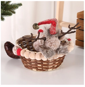 Close-up of reindeer-themed woven Christmas candy basket with plush antlers and festive details